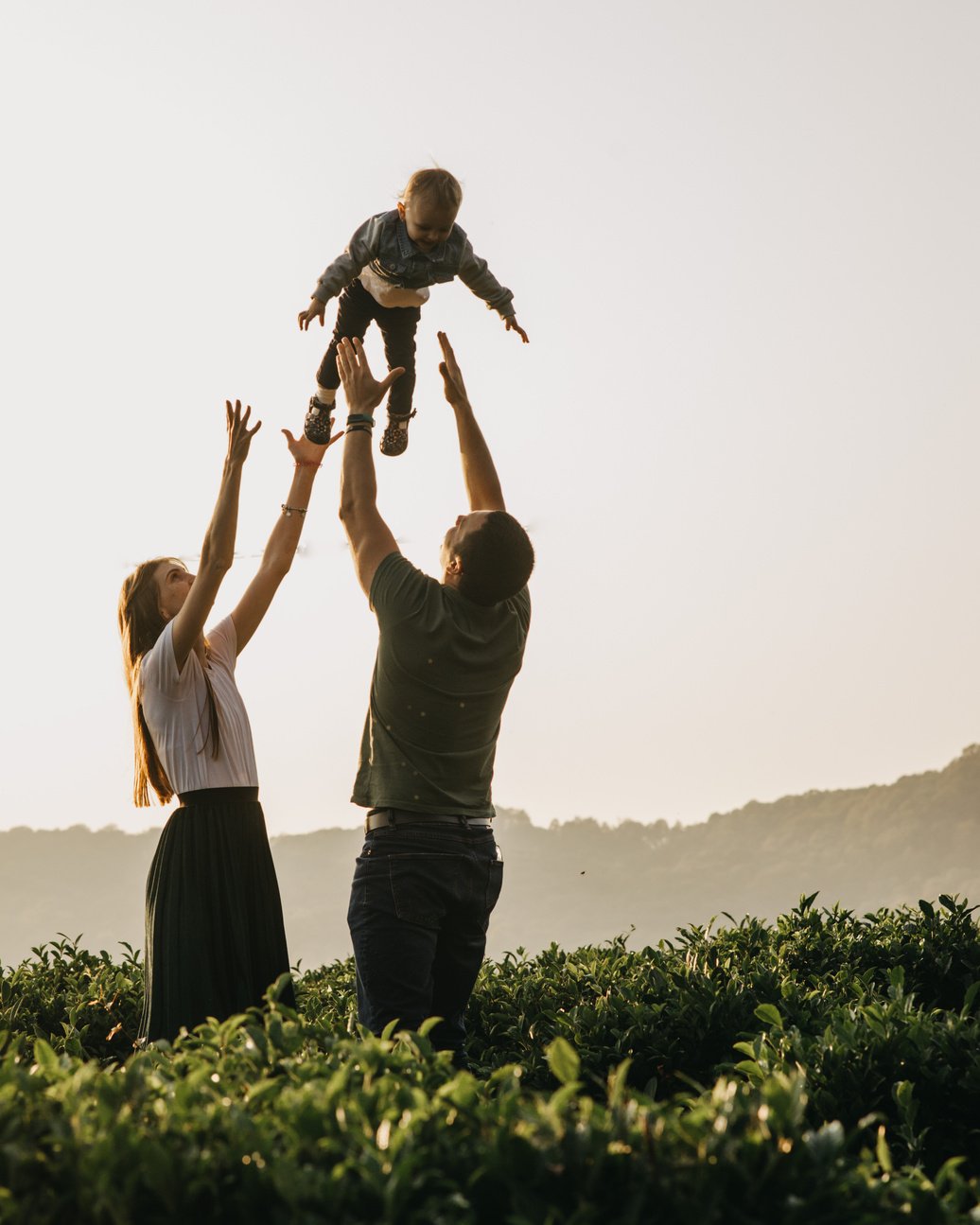 Happy family having fun in countryside